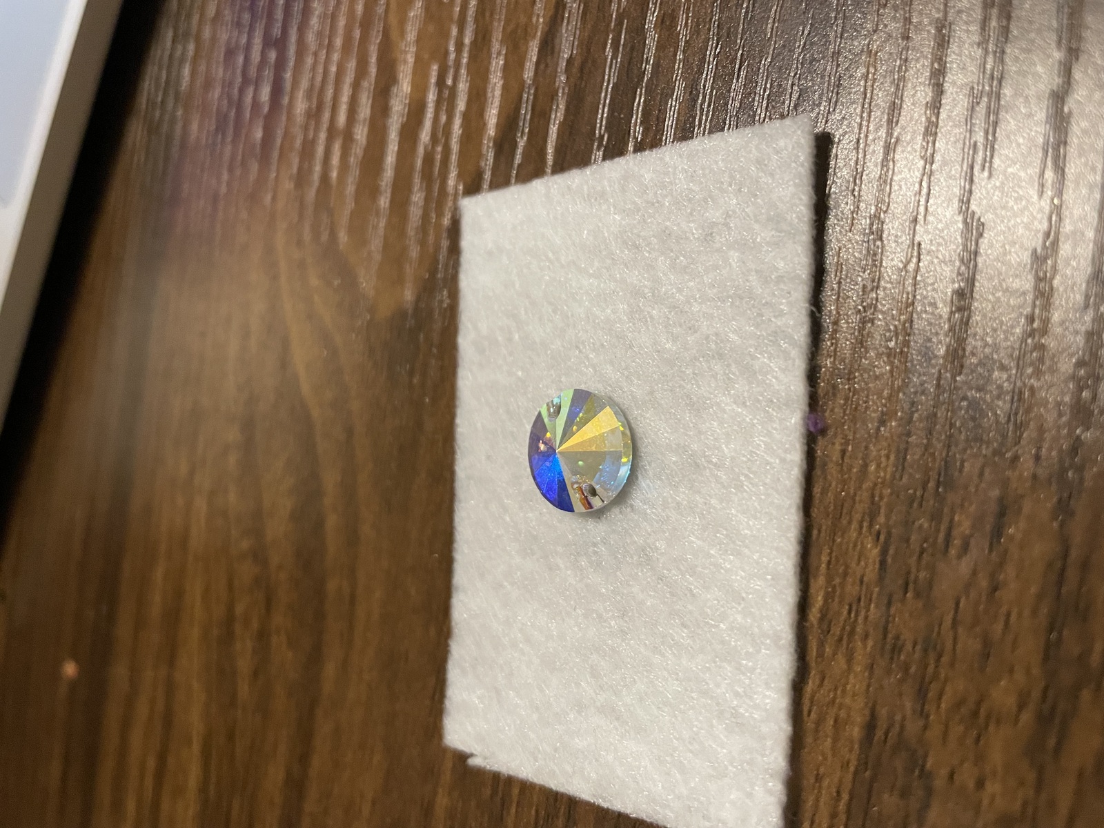 Beaded earring with gem in middle